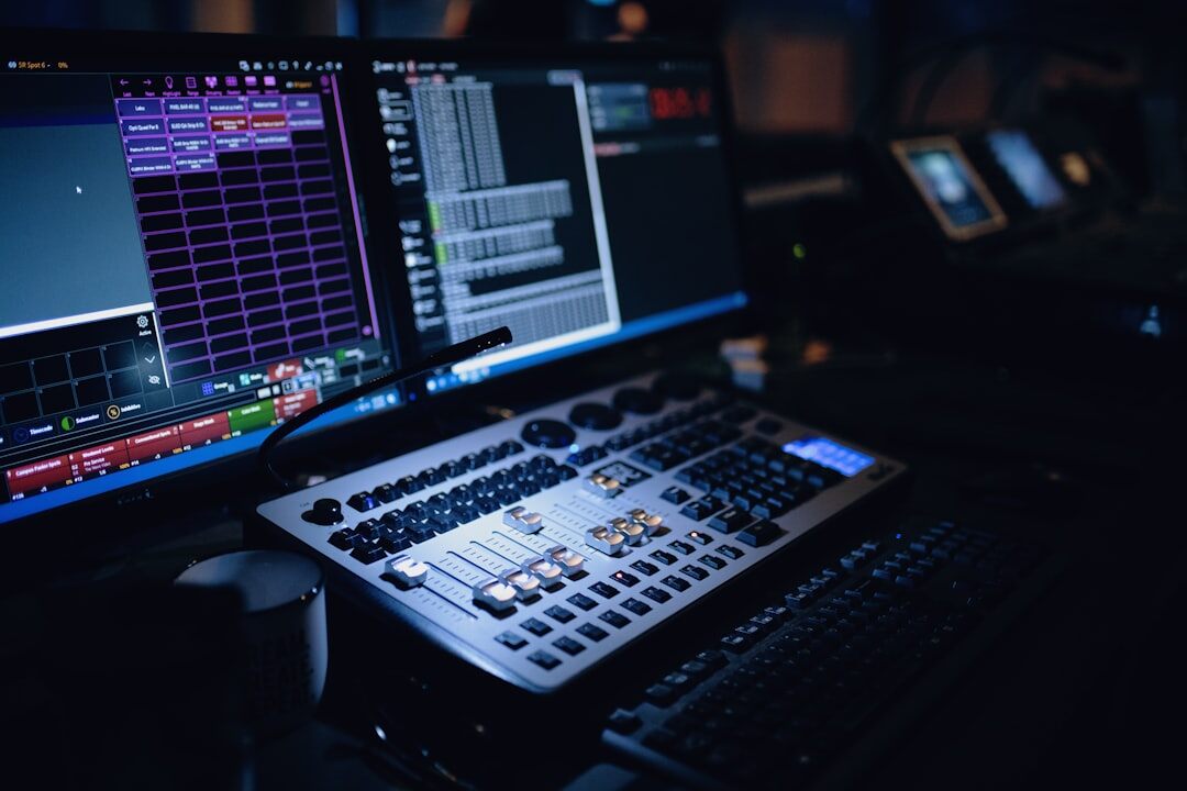 Dark live streaming studio with glowing screens and equipment