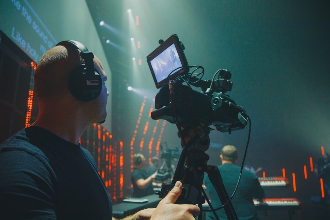 Professional live streaming studio with multiple monitors and camera equipment